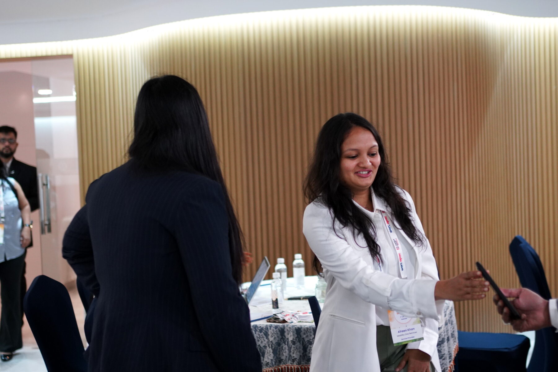 Delegates in conversation between the round tables