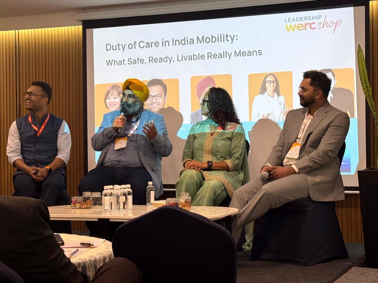 The duty of care panel on stage, with IKAN's Harveer Singh Chadha speaking, the session title on screen behind